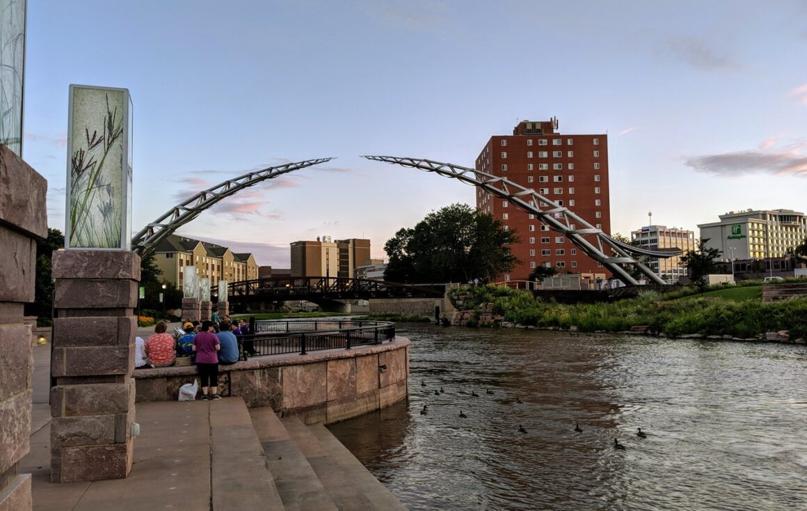 statue of an arc over a land of water