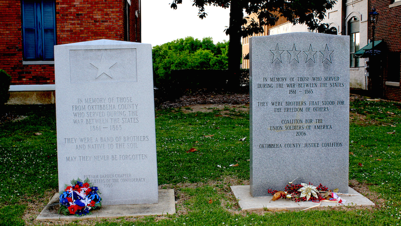 Memorial stones in downtown Starkville, county seat of Oktibbeha County, Mississippi, and home of Mississippi State University. On the left, one honoring Confederate soldiers, erected in 2005. On the right, one honoring Union soldiers, erected in 2006.