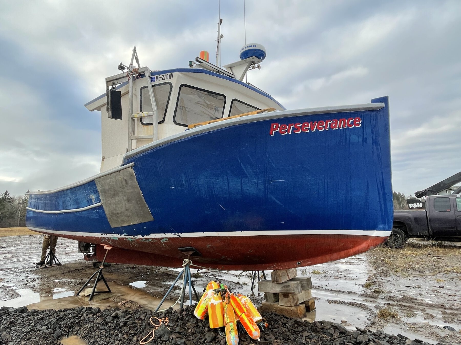 A 32 lobster boat with a blue haul named The Perseverance in Eastport, Maine