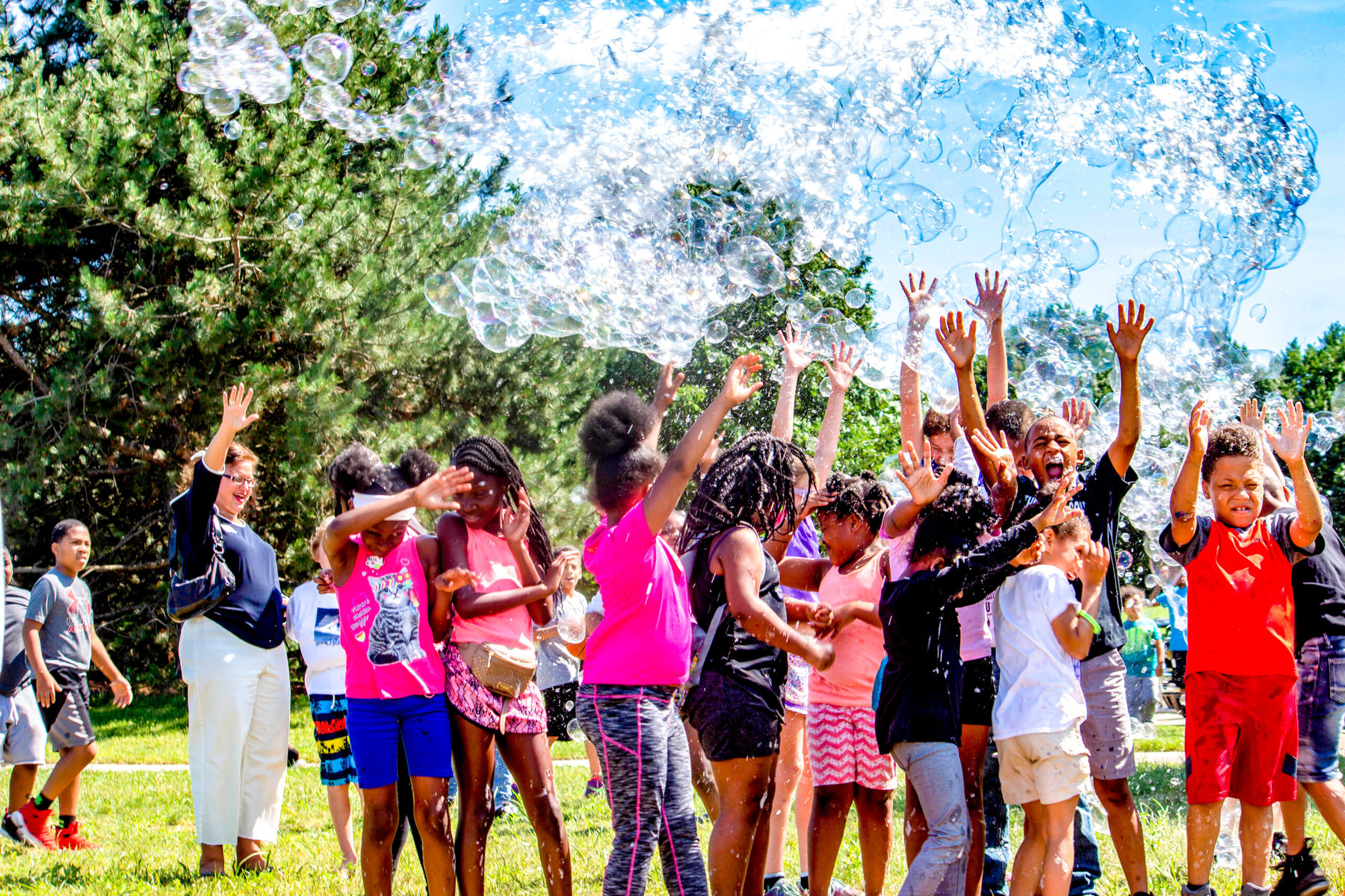 Neighborhood children in Akron enjoy "Bubble Fest" thanks to @Play. Photo courtesy of Art x Love.