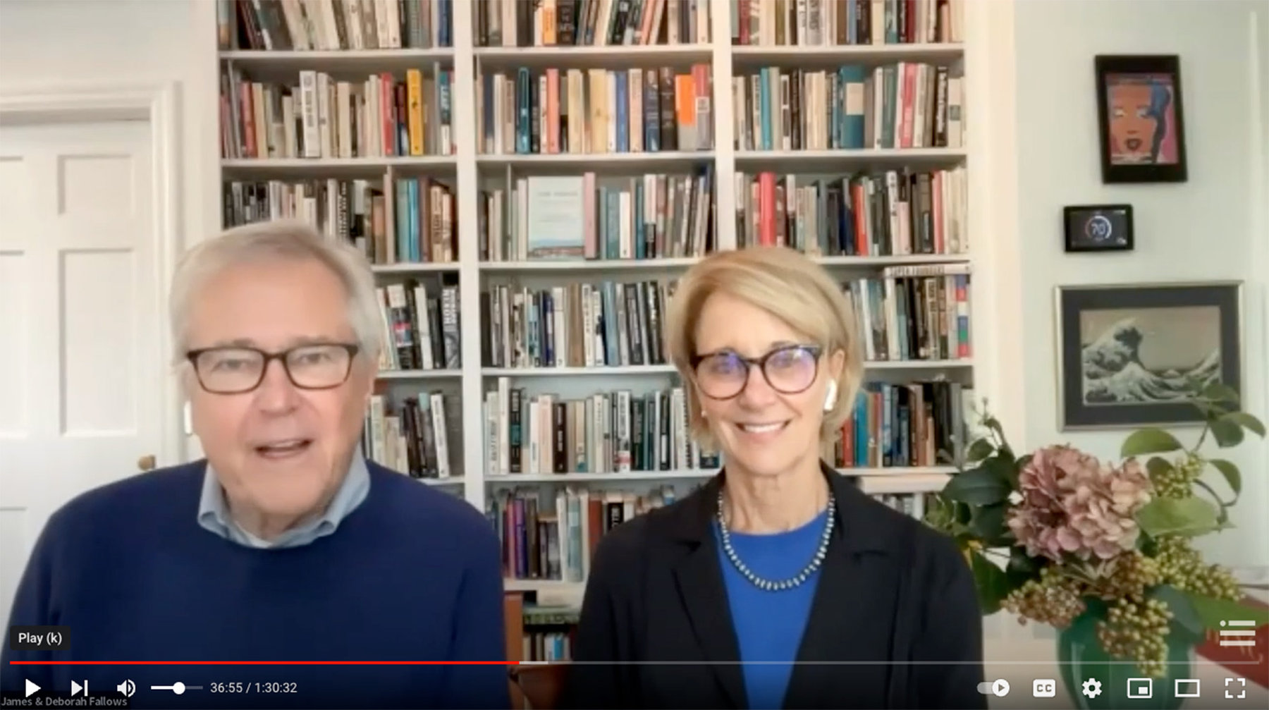 Jim and Deb Fallows sitting in front of a bookshelf.