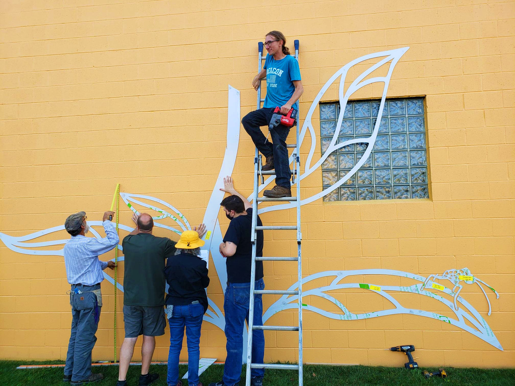 Volunteers install a sculpture at the Crawford County Coalition on Housing Needs in 2020. Photo courtesy My Meadville via Facebook.