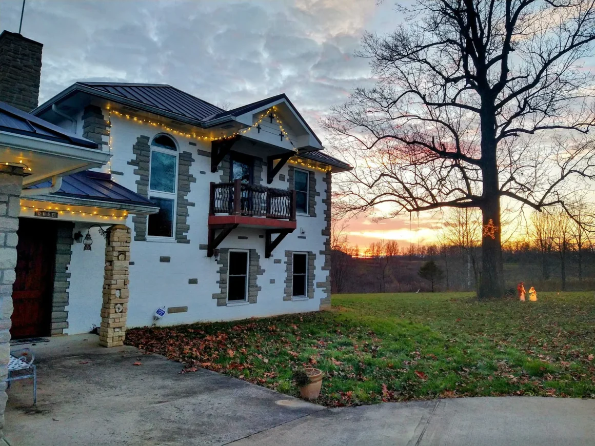 White house in beautiful rural setting, at sunset.